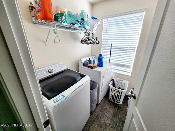 a utility room with dryer and washer