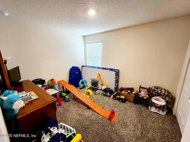 a room with toys and a wooden floor