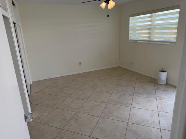 3801 Northeast 22nd Terrace, Unit 12 Lighthouse Point, FL 33064 - Photo 11 of 14 a view of an empty room and a window