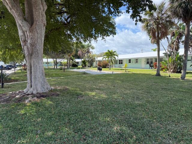 3801 Northeast 22nd Terrace, Unit 12 Lighthouse Point, FL 33064 - Photo 2 of 14 a view of a house with a yard