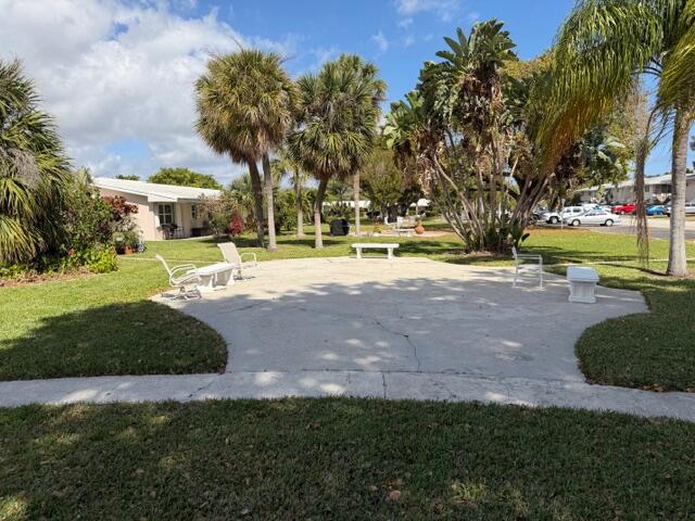 3801 Northeast 22nd Terrace, Unit 12 Lighthouse Point, FL 33064 - Photo 4 of 14 a view of a fountain in front of a house