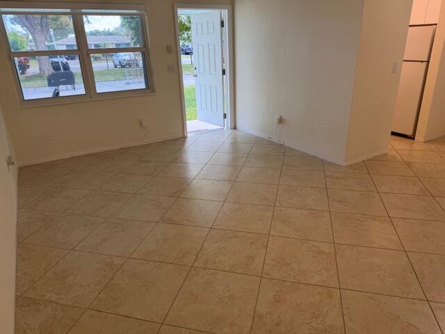 3801 Northeast 22nd Terrace, Unit 12 Lighthouse Point, FL 33064 - Photo 5 of 14 a view of an empty room with a bathroom