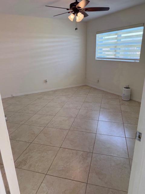 3801 Northeast 22nd Terrace, Unit 12 Lighthouse Point, FL 33064 - Photo 10 of 14 a view of a room with an empty space and a window
