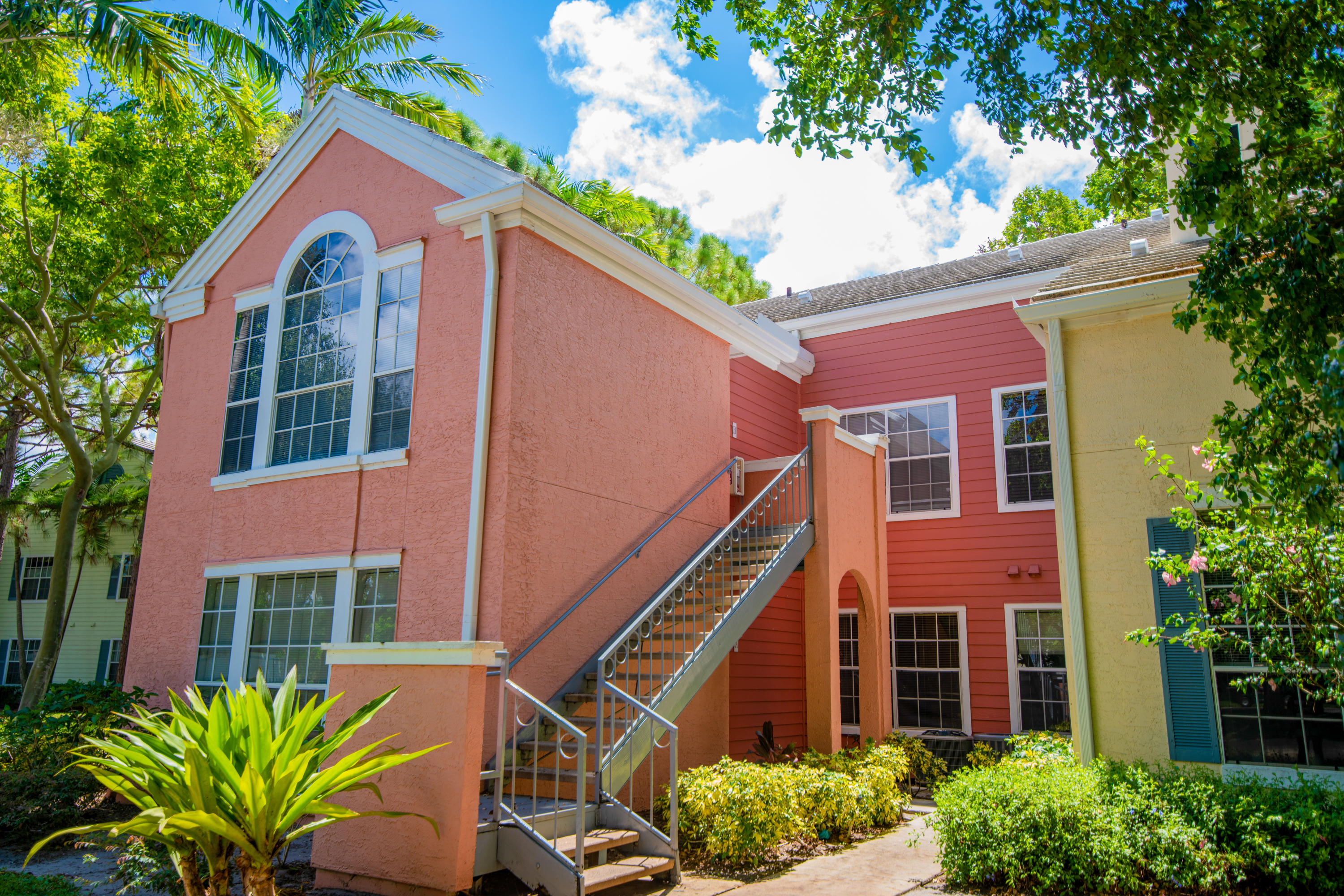 a view of a house with a yard and plants