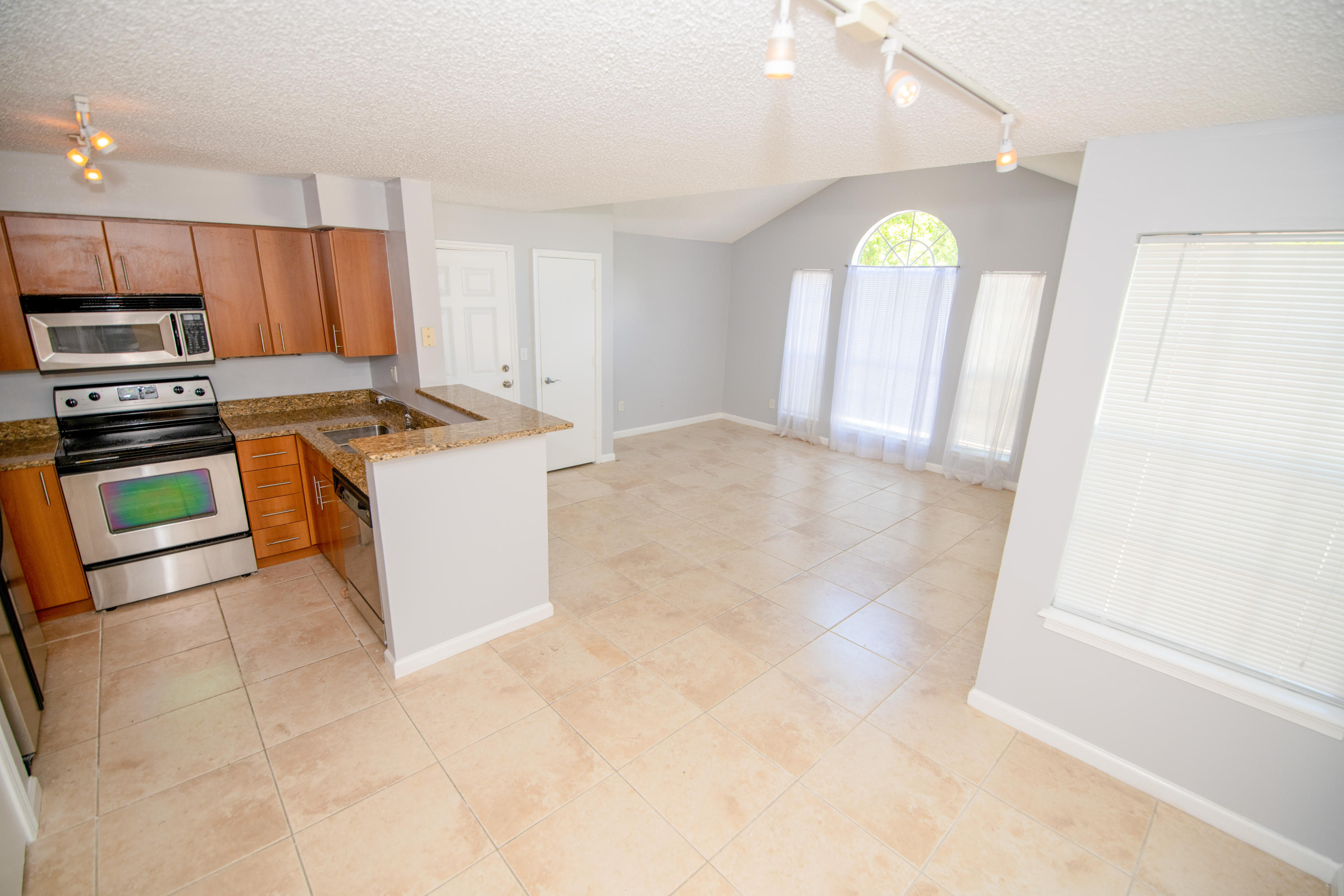 1165 Crystal Way, Unit B Delray Beach, FL 33444 - Photo 11 of 27 a view of a kitchen with a sink