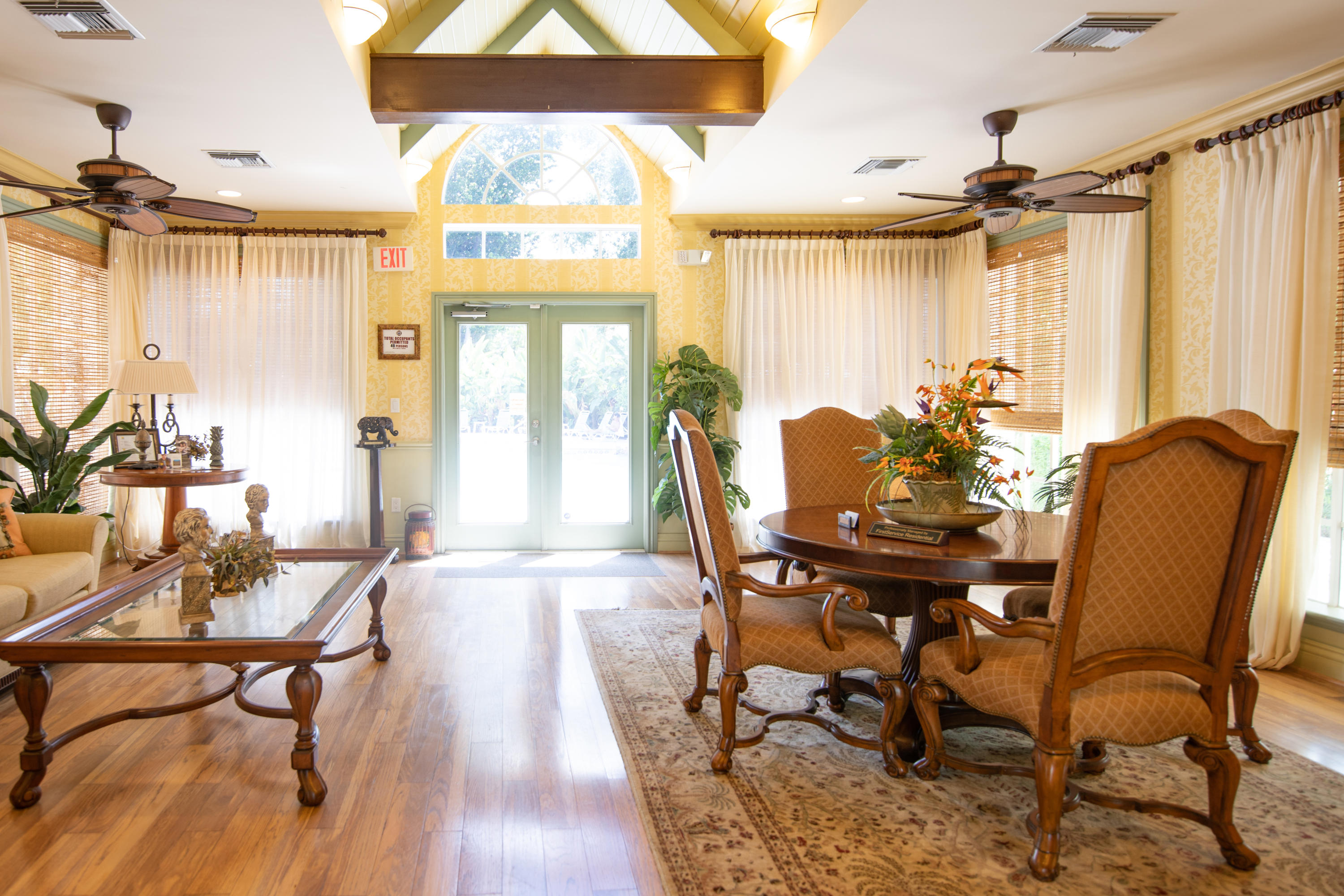 1165 Crystal Way, Unit B Delray Beach, FL 33444 - Photo 22 of 27 a view of a dining room with furniture and chandelier