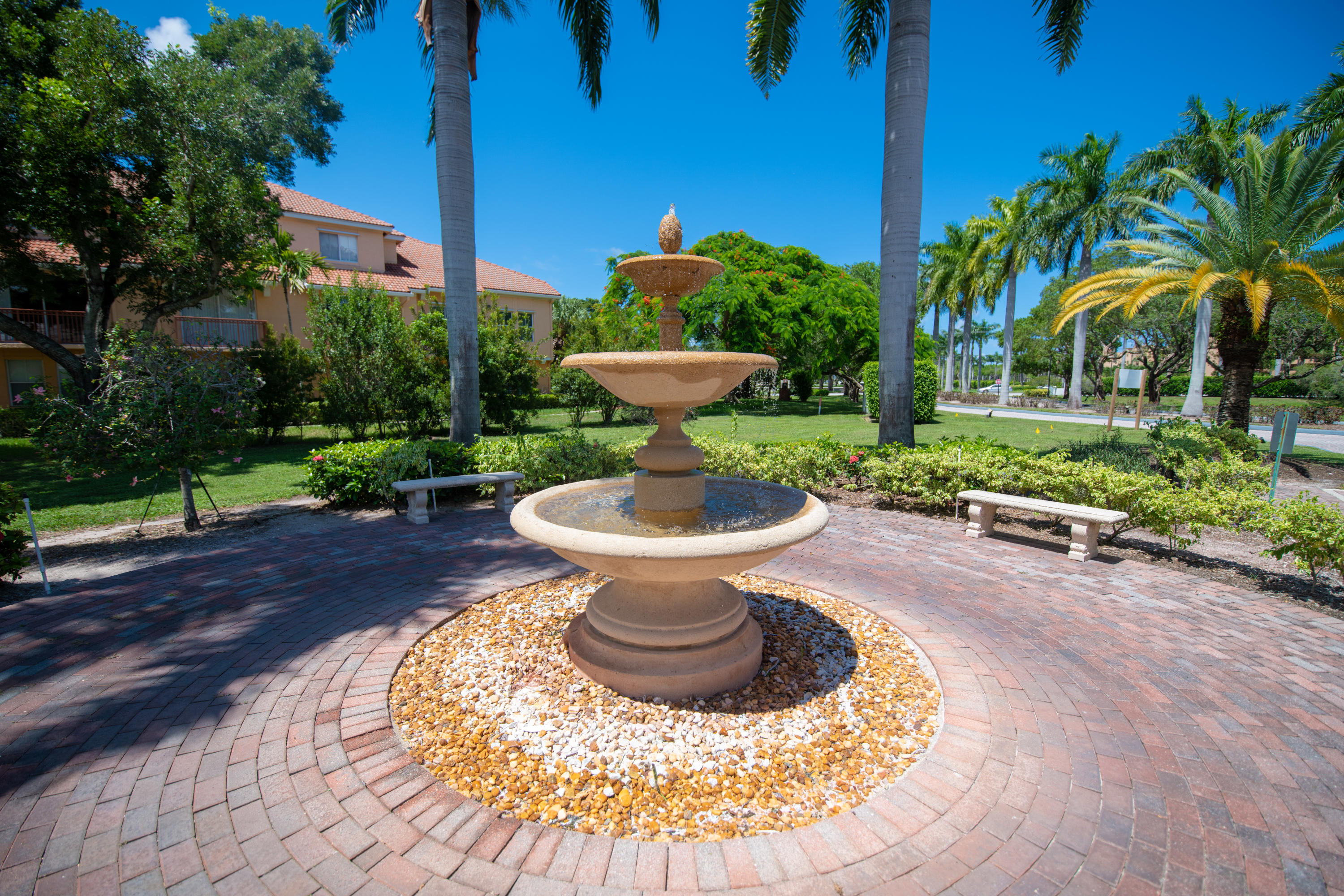 1165 Crystal Way, Unit B Delray Beach, FL 33444 - Photo 23 of 27 a view of a backyard with plants and swimming pool