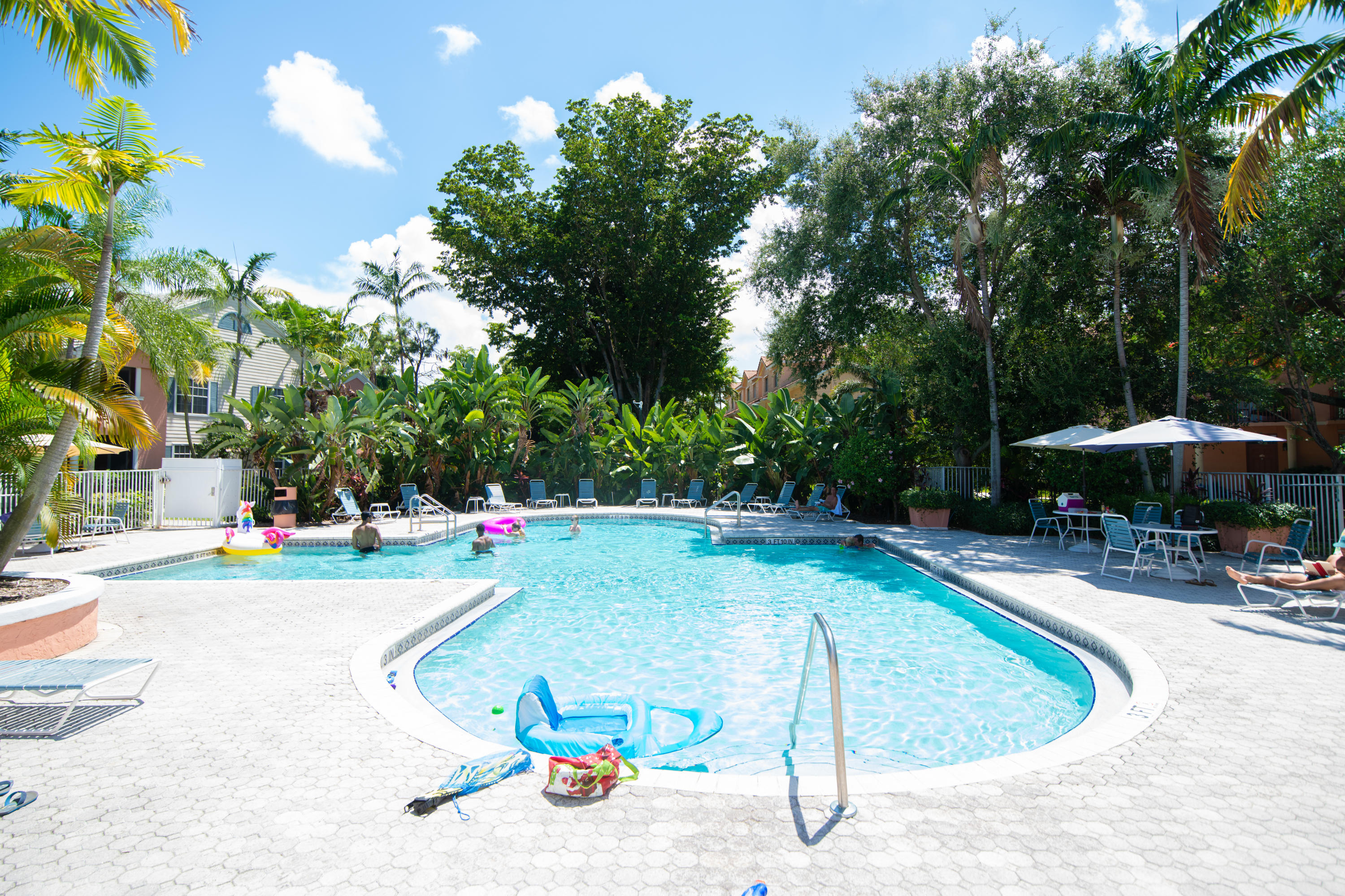 1165 Crystal Way, Unit B Delray Beach, FL 33444 - Photo 24 of 27 a view of a backyard with swimming pool