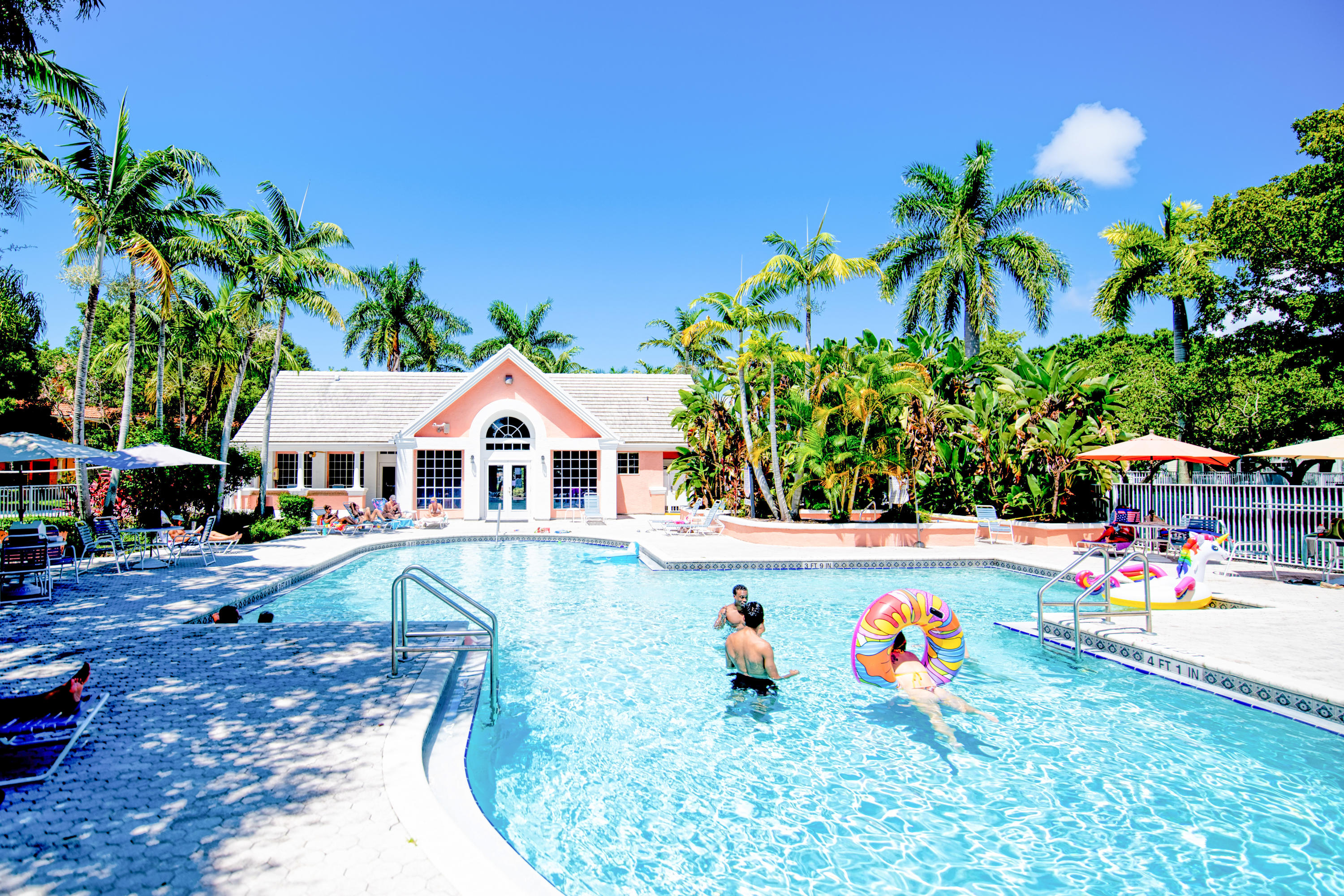1165 Crystal Way, Unit B Delray Beach, FL 33444 - Photo 25 of 27 a view of a house with pool and sitting area