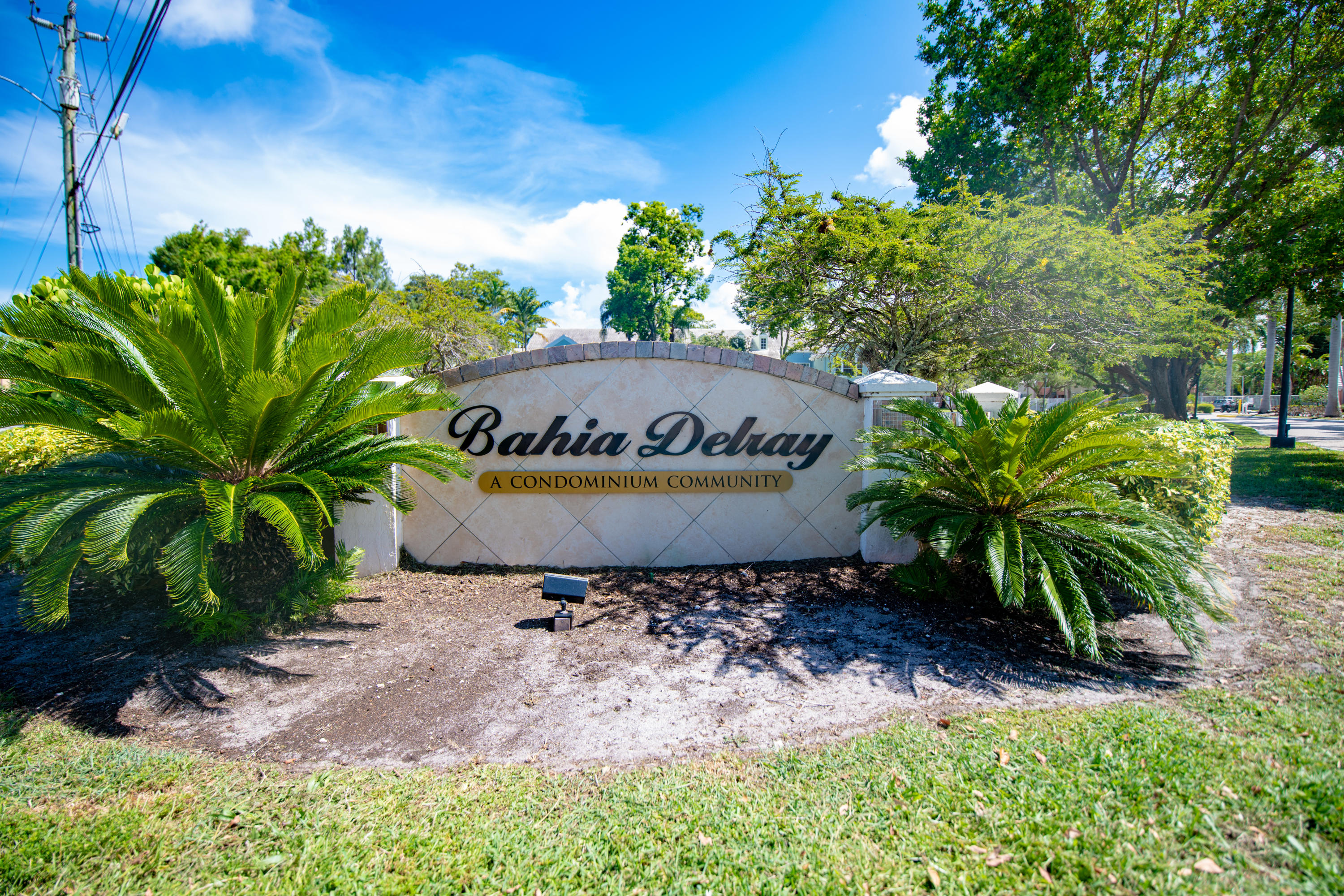 1165 Crystal Way, Unit B Delray Beach, FL 33444 - Photo 3 of 27 a sign that is sitting in front of a building
