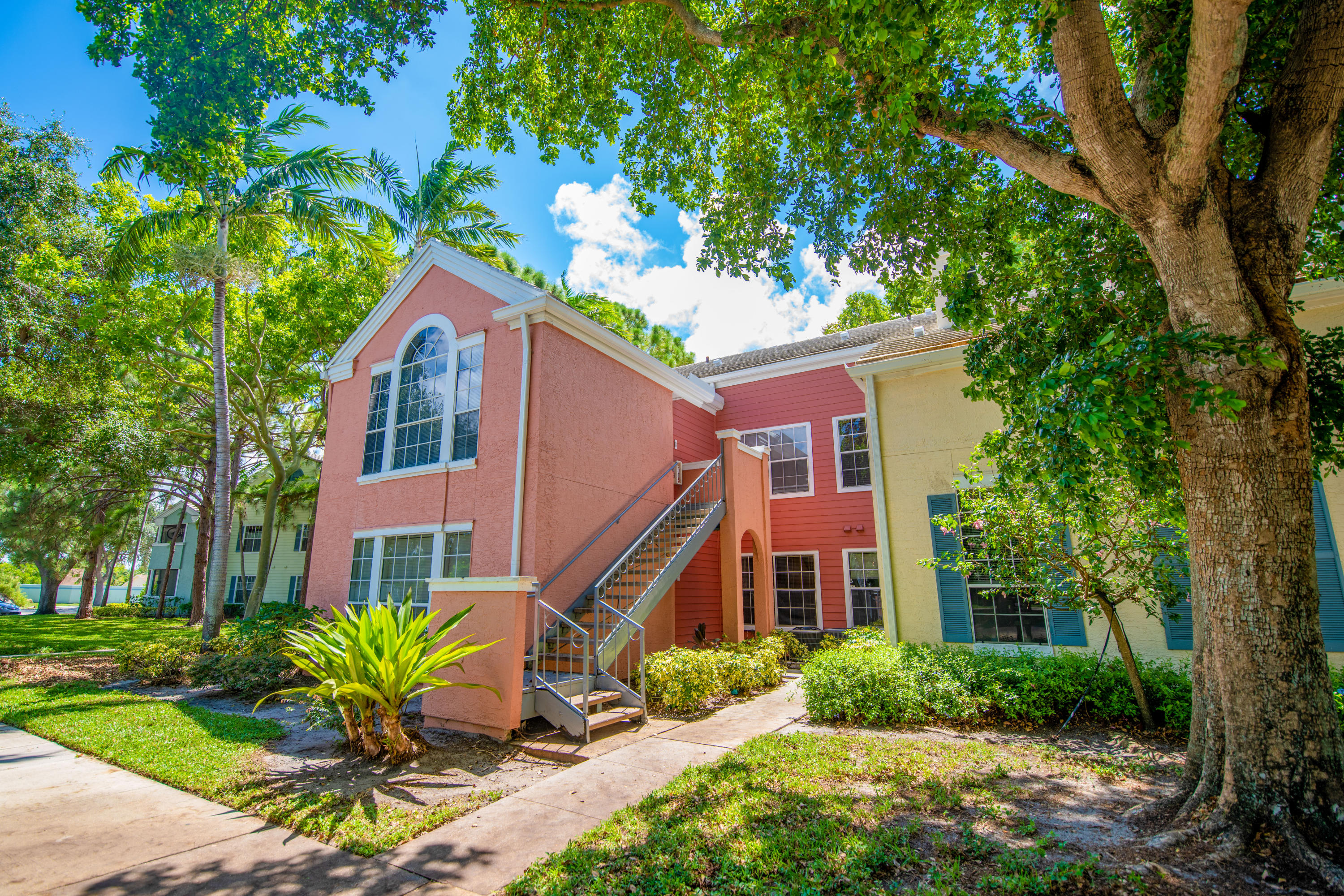 1165 Crystal Way, Unit B Delray Beach, FL 33444 - Photo 4 of 27 a front view of a house with a yard