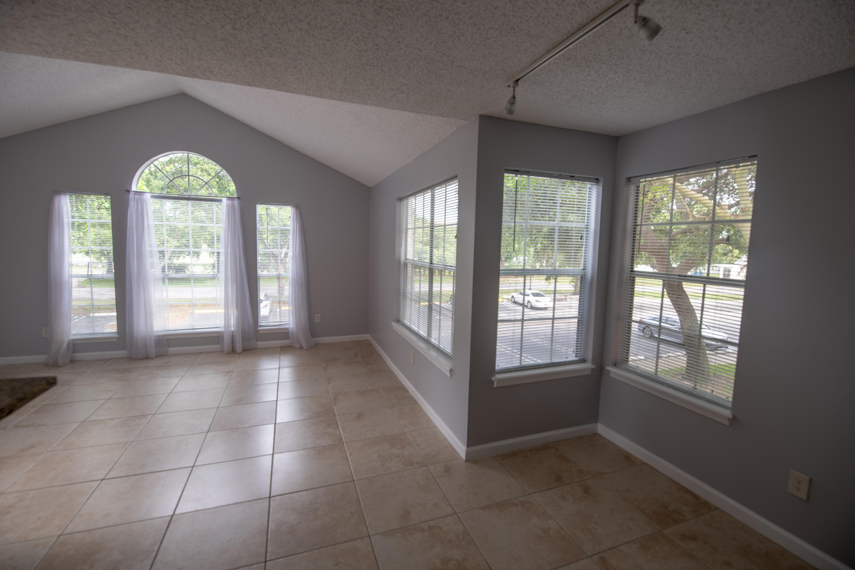 1165 Crystal Way, Unit B Delray Beach, FL 33444 - Photo 7 of 27 a view of an empty room with a window