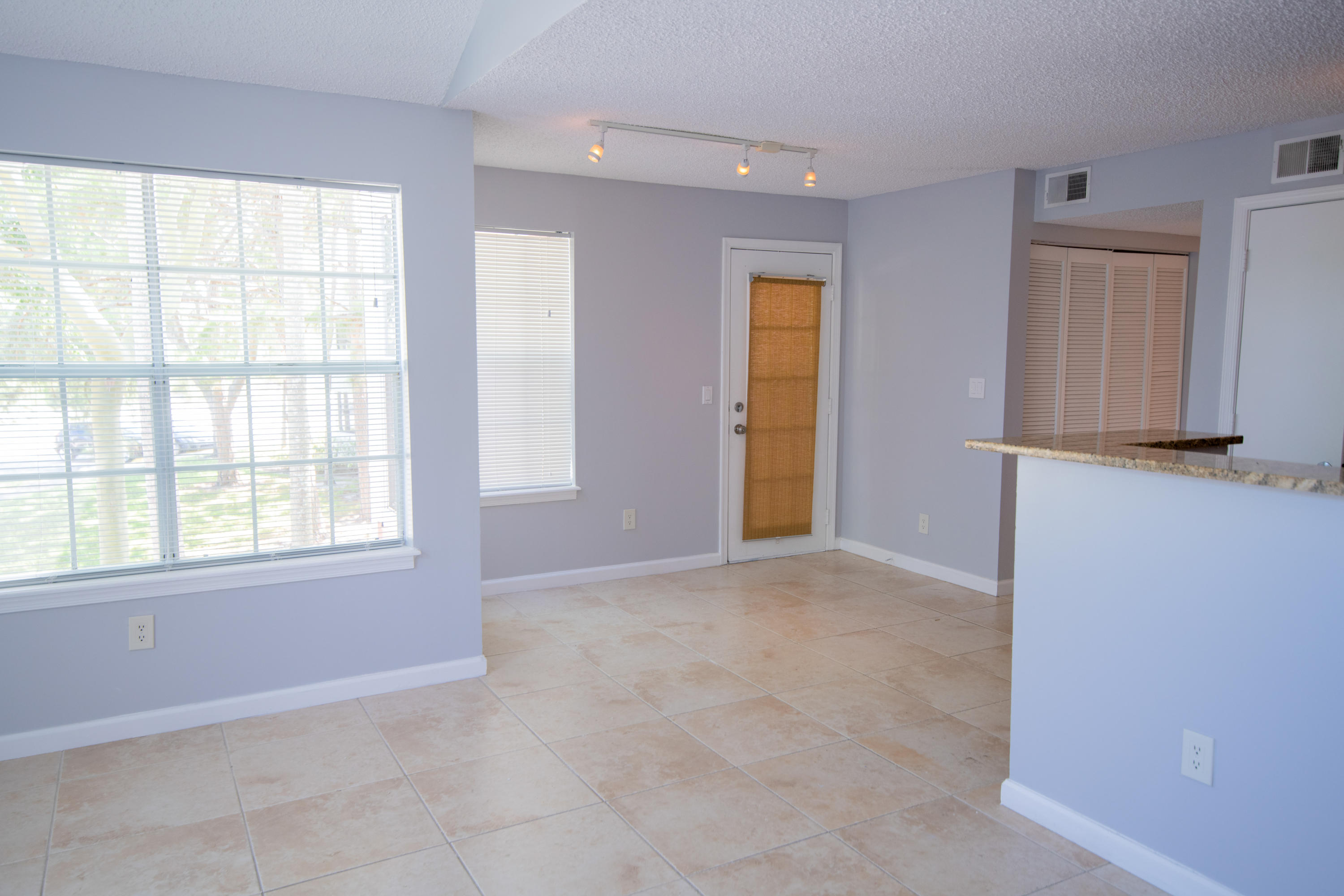 1165 Crystal Way, Unit B Delray Beach, FL 33444 - Photo 10 of 27 a view of an empty room with a window
