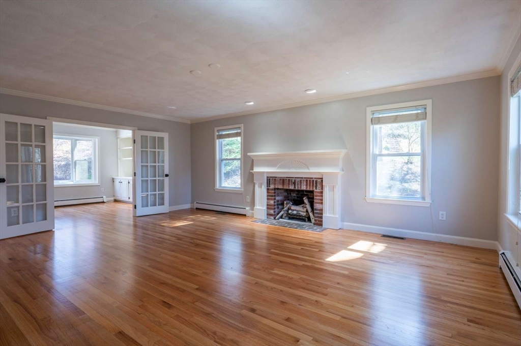 120 Bear Hill Road North Andover, MA 01845 - Photo 15 of 42 a view of an empty room with wooden floor and a window