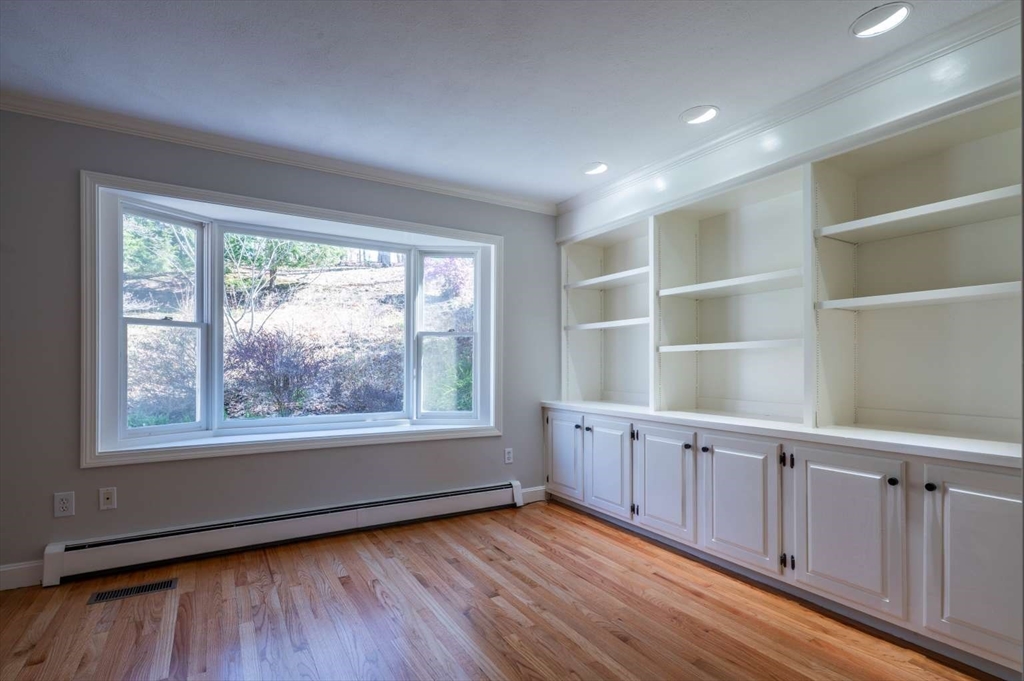 120 Bear Hill Road North Andover, MA 01845 - Photo 17 of 42 an empty room with wooden floor and windows