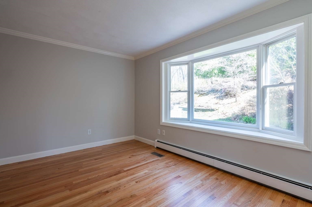 120 Bear Hill Road North Andover, MA 01845 - Photo 18 of 42 a view of a room with wooden floor and window