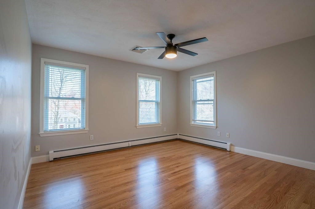 120 Bear Hill Road North Andover, MA 01845 - Photo 20 of 42 a view of an empty room with wooden floor and a window