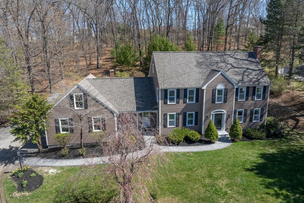120 Bear Hill Road North Andover, MA 01845 - Photo 2 of 42 a aerial view of a house next to a big yard and large trees