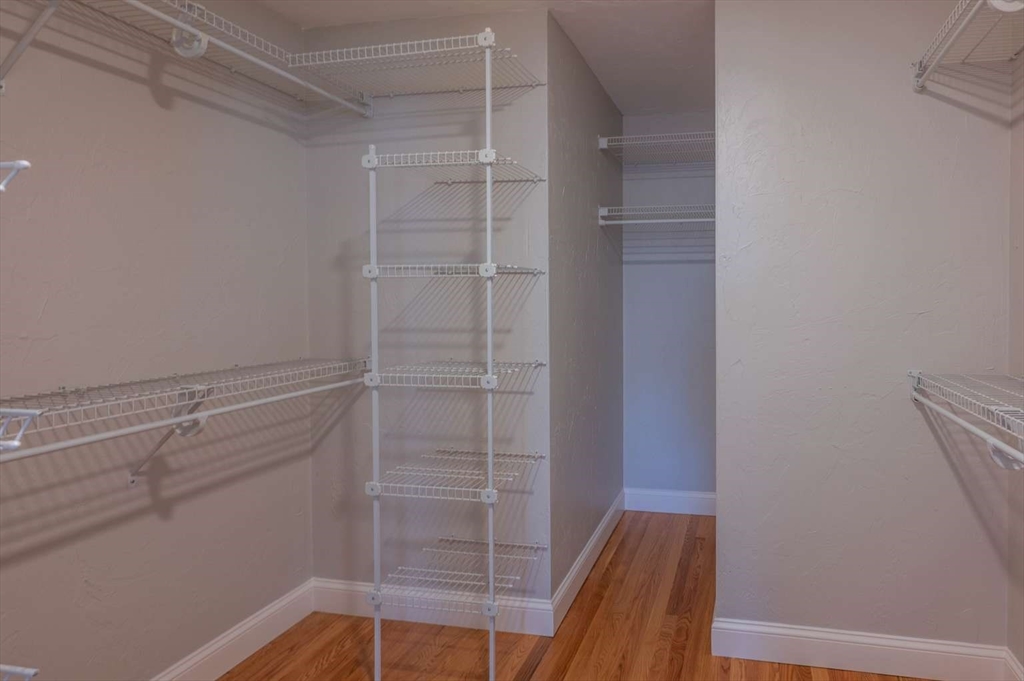 120 Bear Hill Road North Andover, MA 01845 - Photo 22 of 42 a view of walk in closet with empty racks