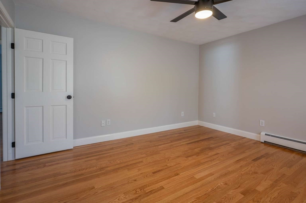 120 Bear Hill Road North Andover, MA 01845 - Photo 28 of 42 a view of an empty room with wooden floor