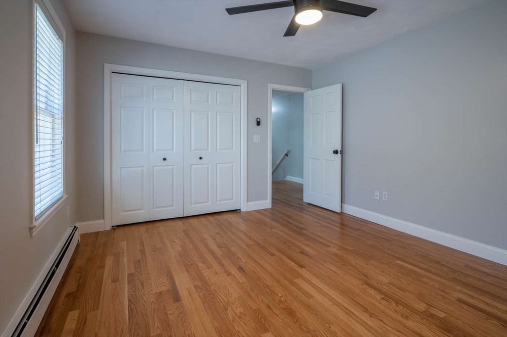 120 Bear Hill Road North Andover, MA 01845 - Photo 29 of 42 a view of an empty room with wooden floor and a window