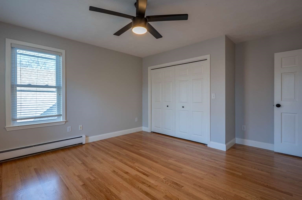 120 Bear Hill Road North Andover, MA 01845 - Photo 30 of 42 wooden floor in an empty room with a window