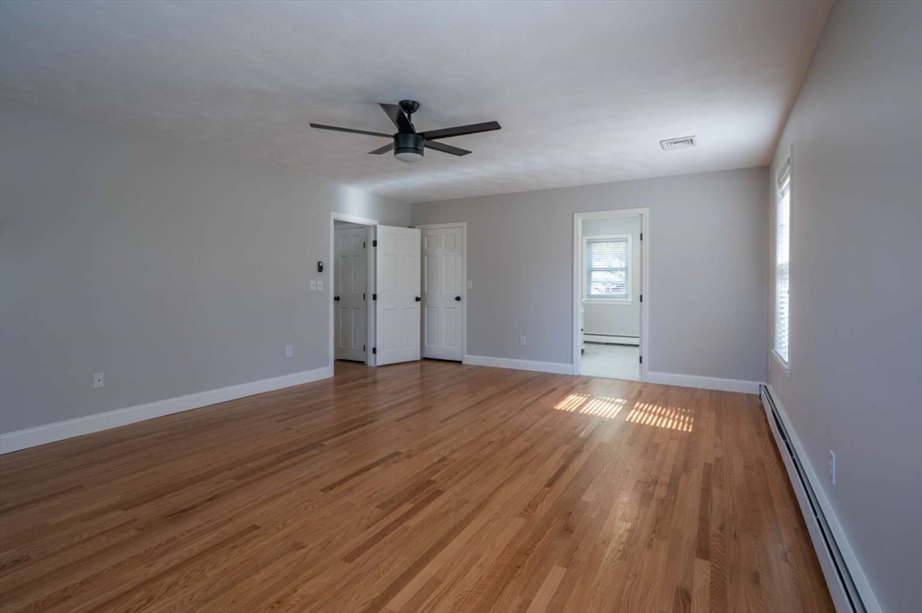 120 Bear Hill Road North Andover, MA 01845 - Photo 31 of 42 wooden floor in an empty room with a window