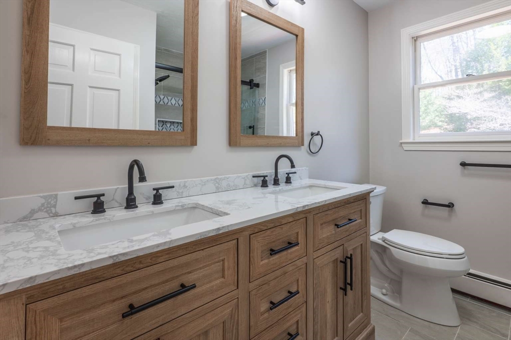 120 Bear Hill Road North Andover, MA 01845 - Photo 32 of 42 a bathroom with a granite countertop toilet sink double and mirror