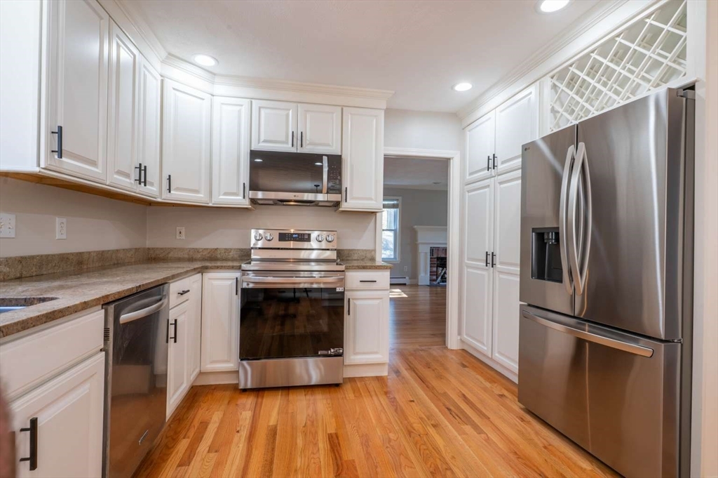 120 Bear Hill Road North Andover, MA 01845 - Photo 4 of 42 a kitchen with stainless steel appliances a refrigerator stove and microwave