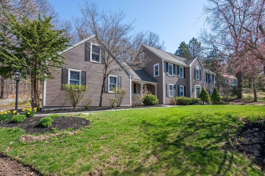 120 Bear Hill Road North Andover, MA 01845 - Photo 41 of 42 a front view of a house with a yard and trees