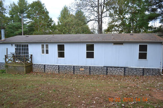 5151 Turners Creek Road Ferrum, VA 24088 - Photo 14 of 20 a front view of a house with garden