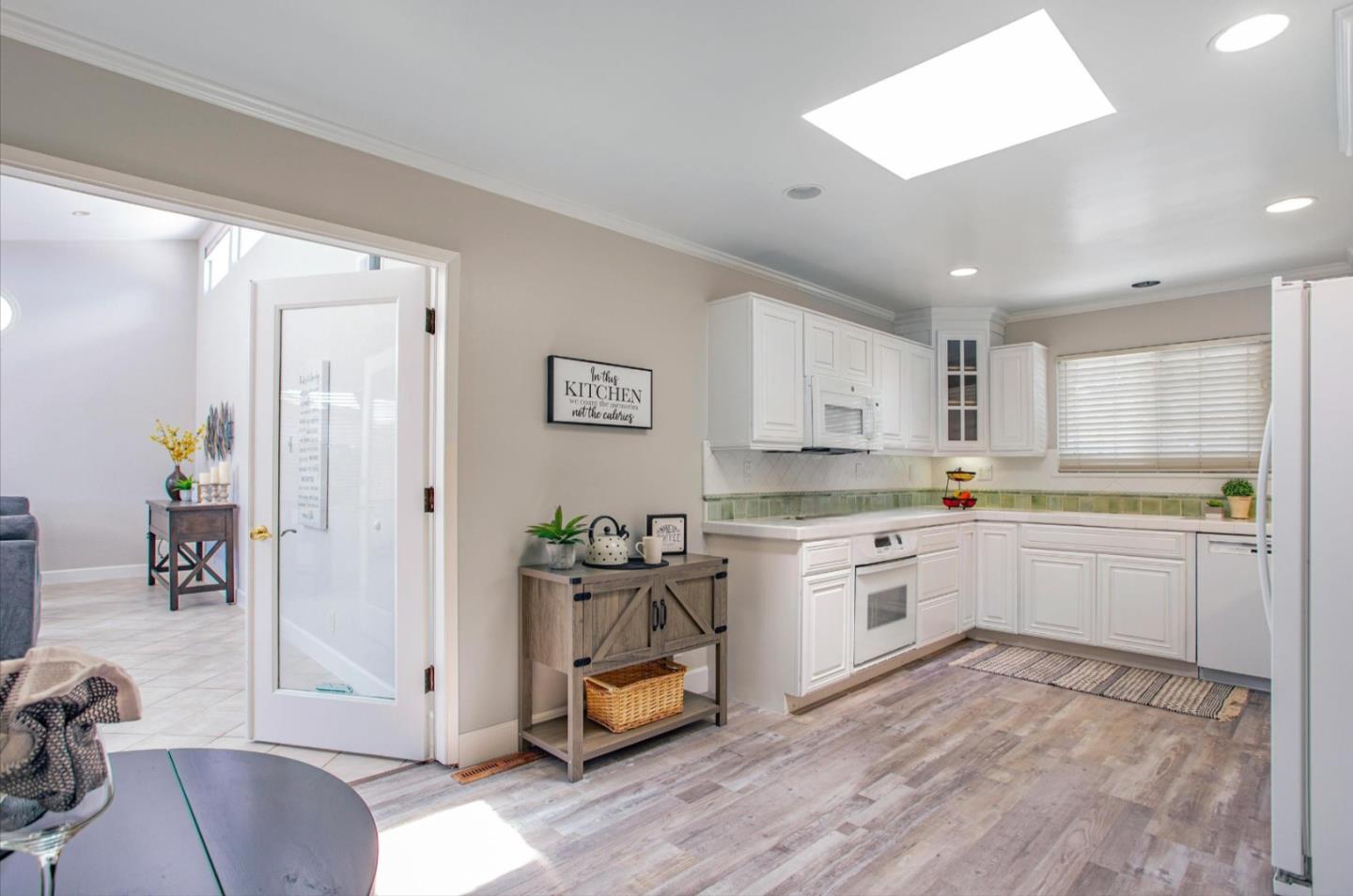 1001 Tweed Street Seaside, CA 93955 - Photo 15 of 35 a kitchen with granite countertop white cabinets and white appliances