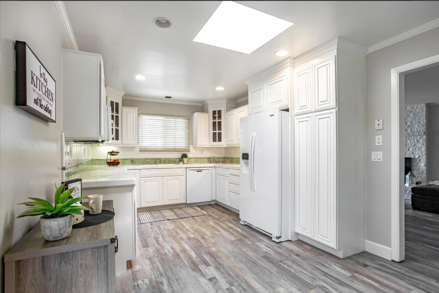 1001 Tweed Street Seaside, CA 93955 - Photo 16 of 35 a kitchen with white cabinets and white appliances