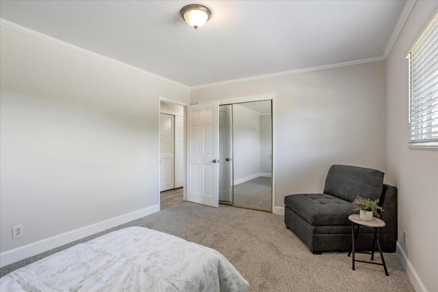 1001 Tweed Street Seaside, CA 93955 - Photo 23 of 35 a bedroom with a bed and chair