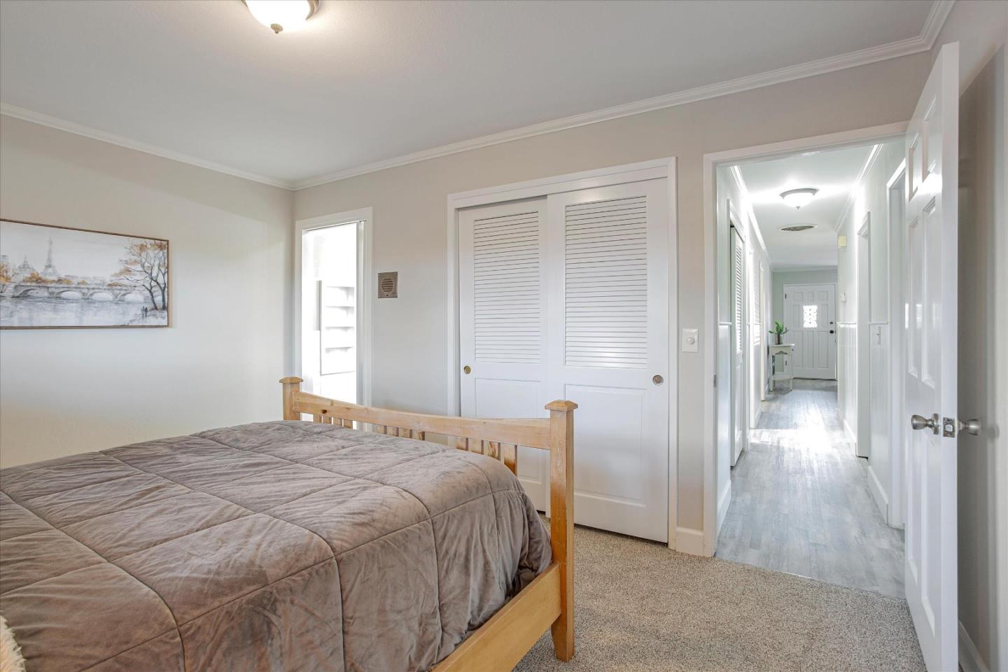 1001 Tweed Street Seaside, CA 93955 - Photo 25 of 35 a bedroom with a bed and a mirror