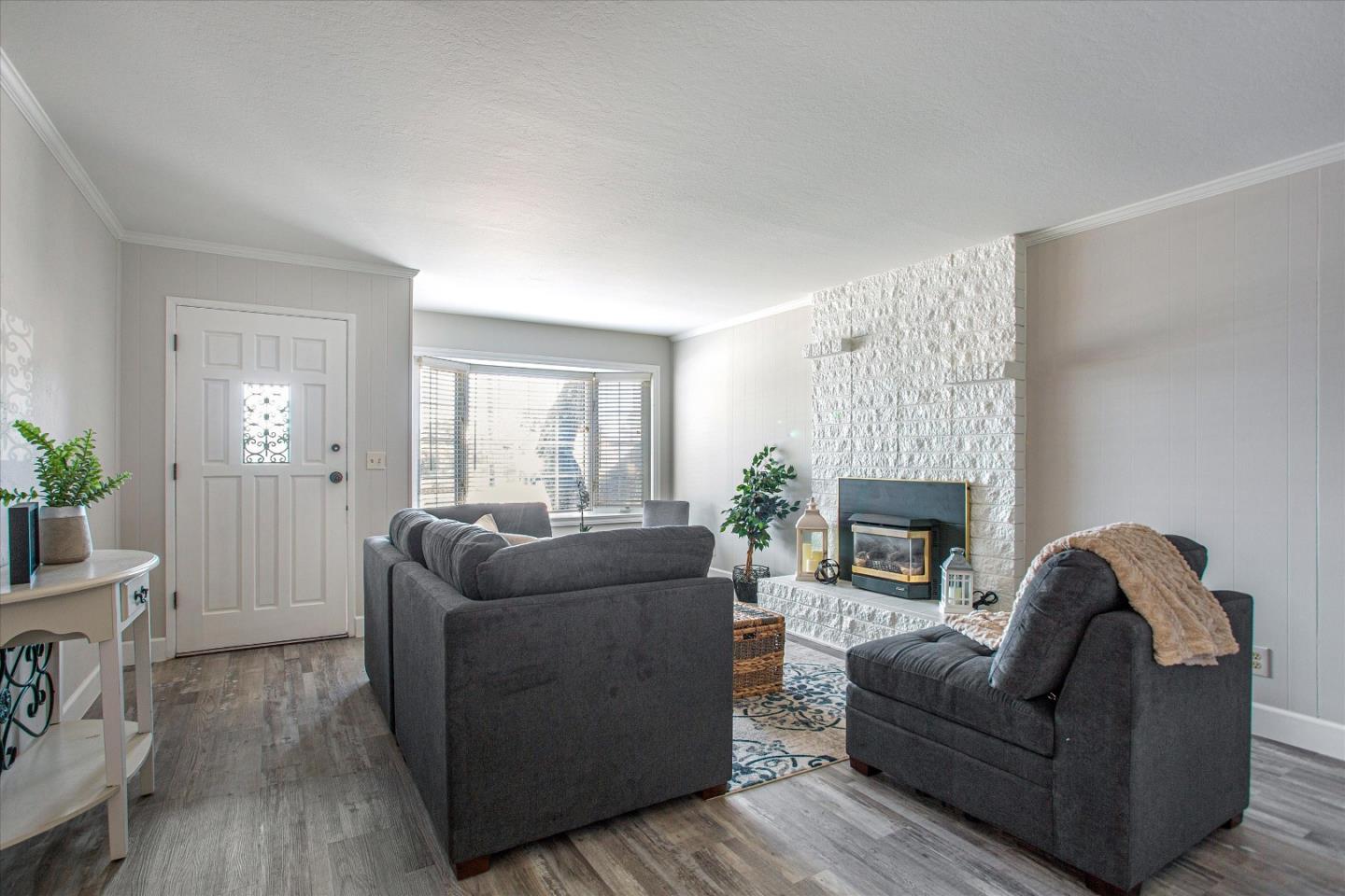 1001 Tweed Street Seaside, CA 93955 - Photo 6 of 35 a living room with furniture and a fireplace