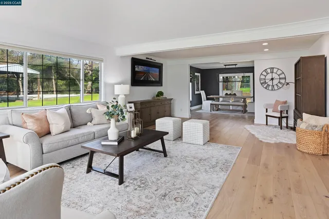 a living room with fireplace furniture and a flat screen tv