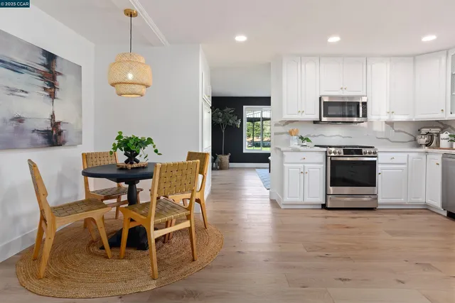 a bathroom with a sink double vanity granite and a mirror