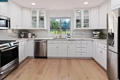 a bed room with furniture and a flat screen tv
