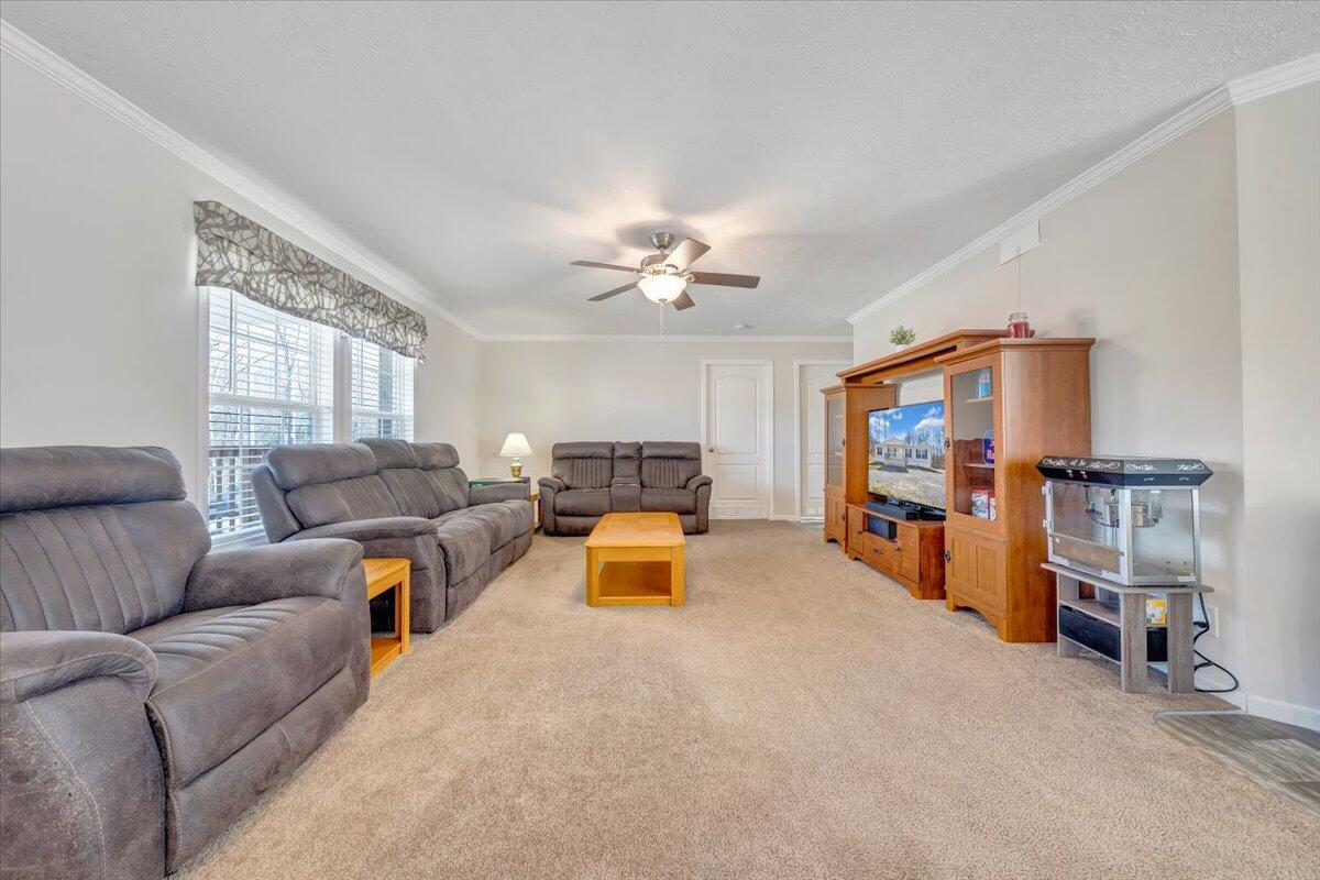 4063 Saunders Road Vinton, VA 24179 - Photo 3 of 37 a living room with furniture and a chandelier