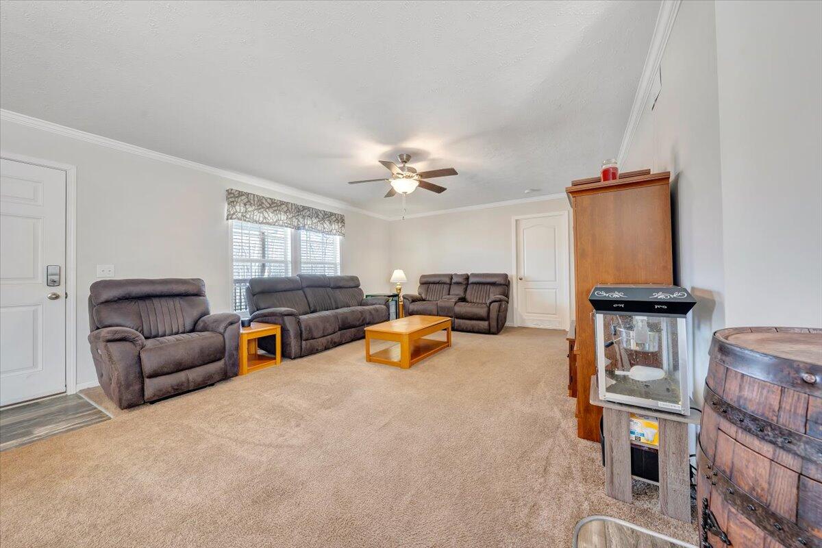 4063 Saunders Road Vinton, VA 24179 - Photo 4 of 37 a living room with furniture and a chandelier