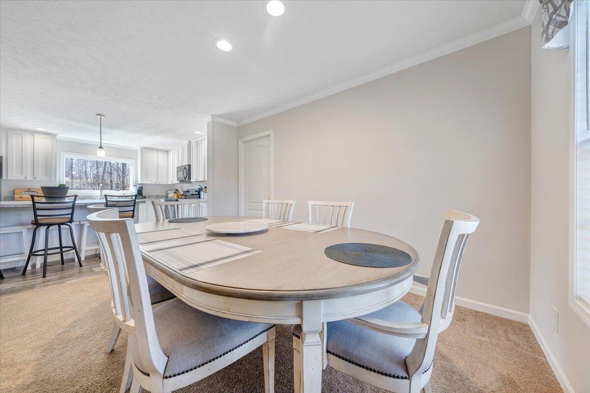 4063 Saunders Road Vinton, VA 24179 - Photo 8 of 37 a dining room with furniture and wooden floor