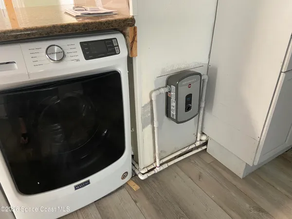 a utility room with dryer and washer