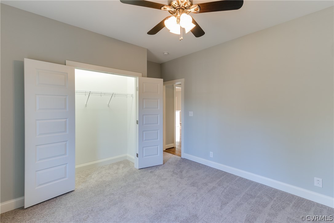 1809 Hawk Town Road Maidens, VA 23102 - Photo 17 of 24 an empty room with closet and a chandelier fan