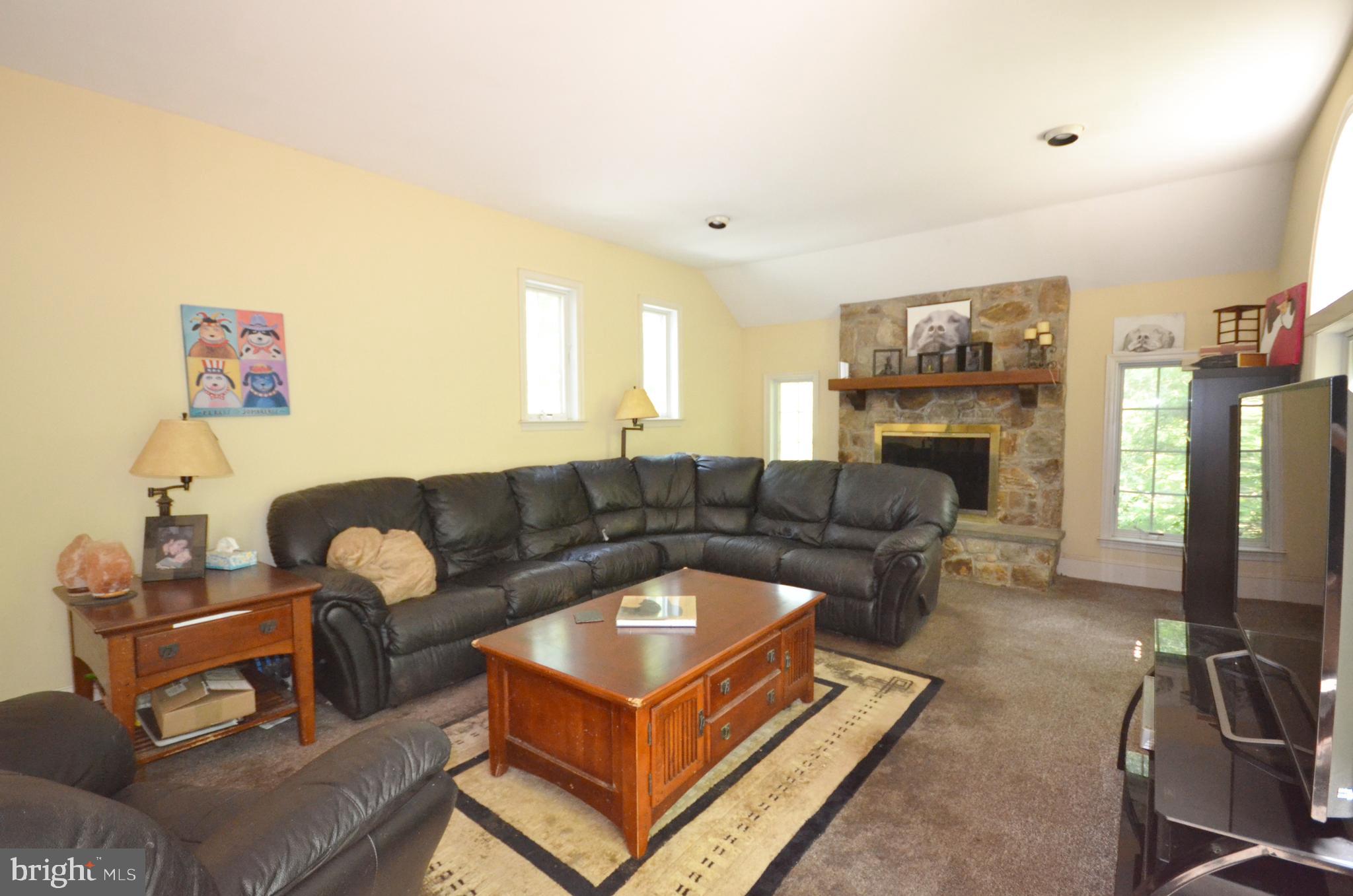 400 Upper Weadley Road Wayne, PA 19087 - Photo 15 of 15 Family Room with Fireplace and Doors to Patio