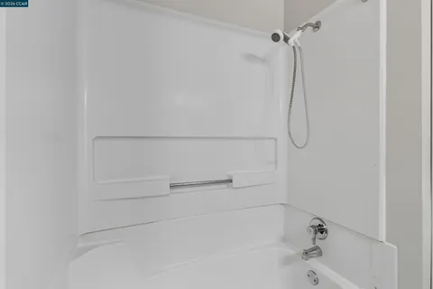 a close up view of a bathtub in bathroom