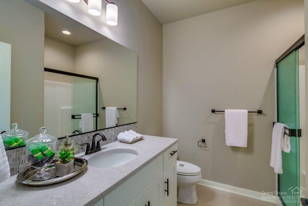 4620 Southwest 36th Street Redmond, OR 97756 - Photo 21 of 22 Guest bath. Similar property photo with the same floorplan. Finishes and specs vary.