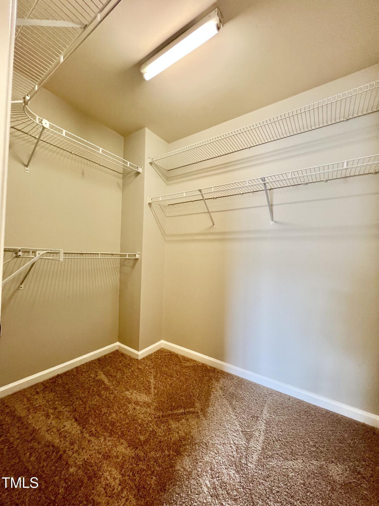 2118 Kedvale Avenue Raleigh, NC 27617 - Photo 16 of 17 a view of a room with racks on the wall