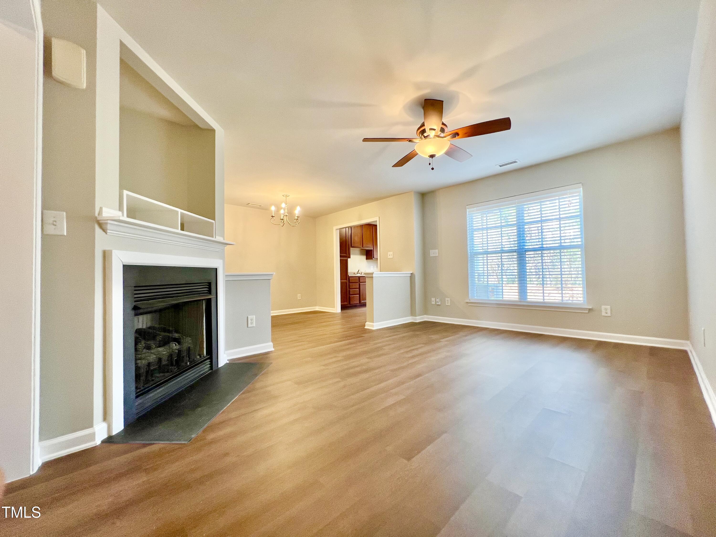 2118 Kedvale Avenue Raleigh, NC 27617 - Photo 5 of 17 a view of an empty room with window and fireplace