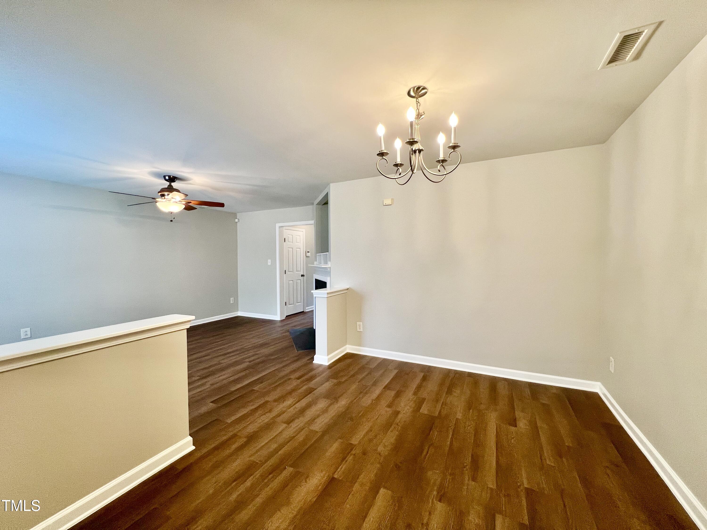 2118 Kedvale Avenue Raleigh, NC 27617 - Photo 7 of 17 wooden floor in an empty room with a window